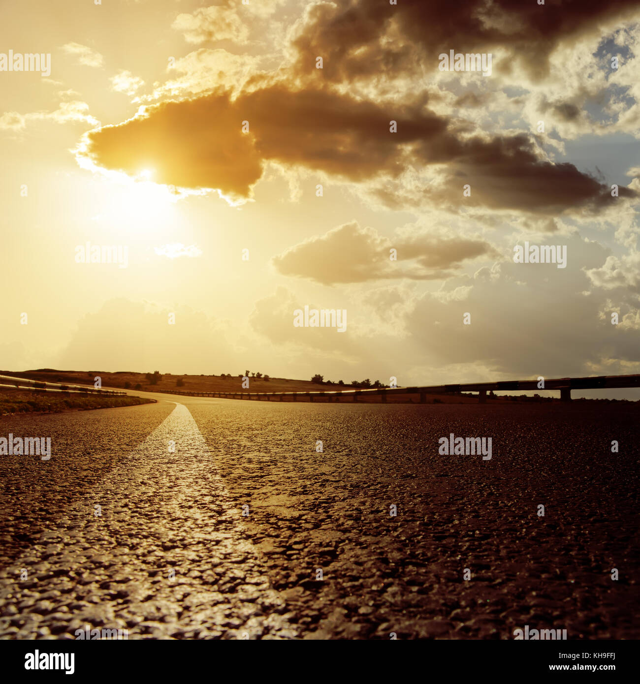 dramatic sunset and asphalt road Stock Photo - Alamy