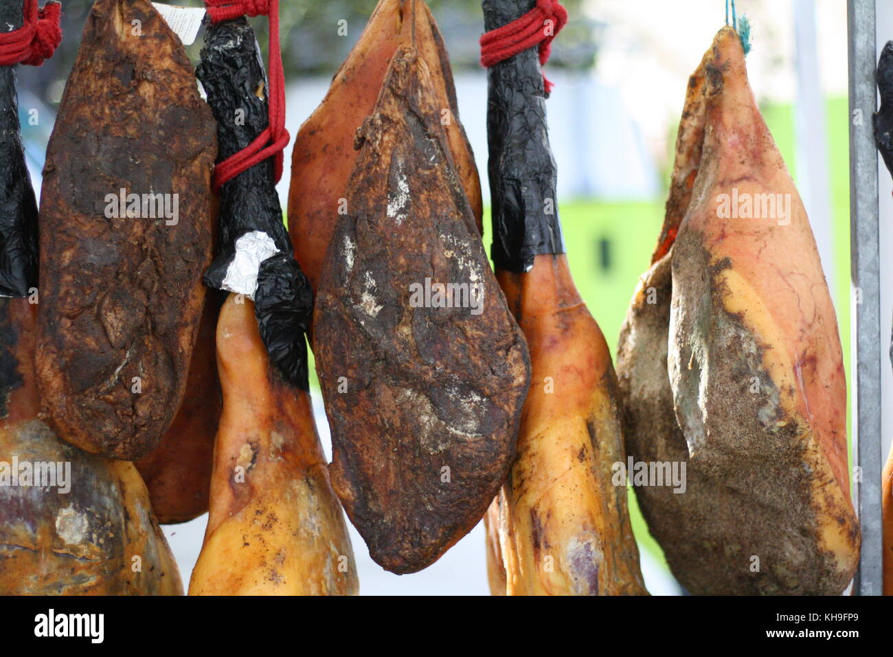 Dried and cured ham hanging on sale Stock Photo Alamy