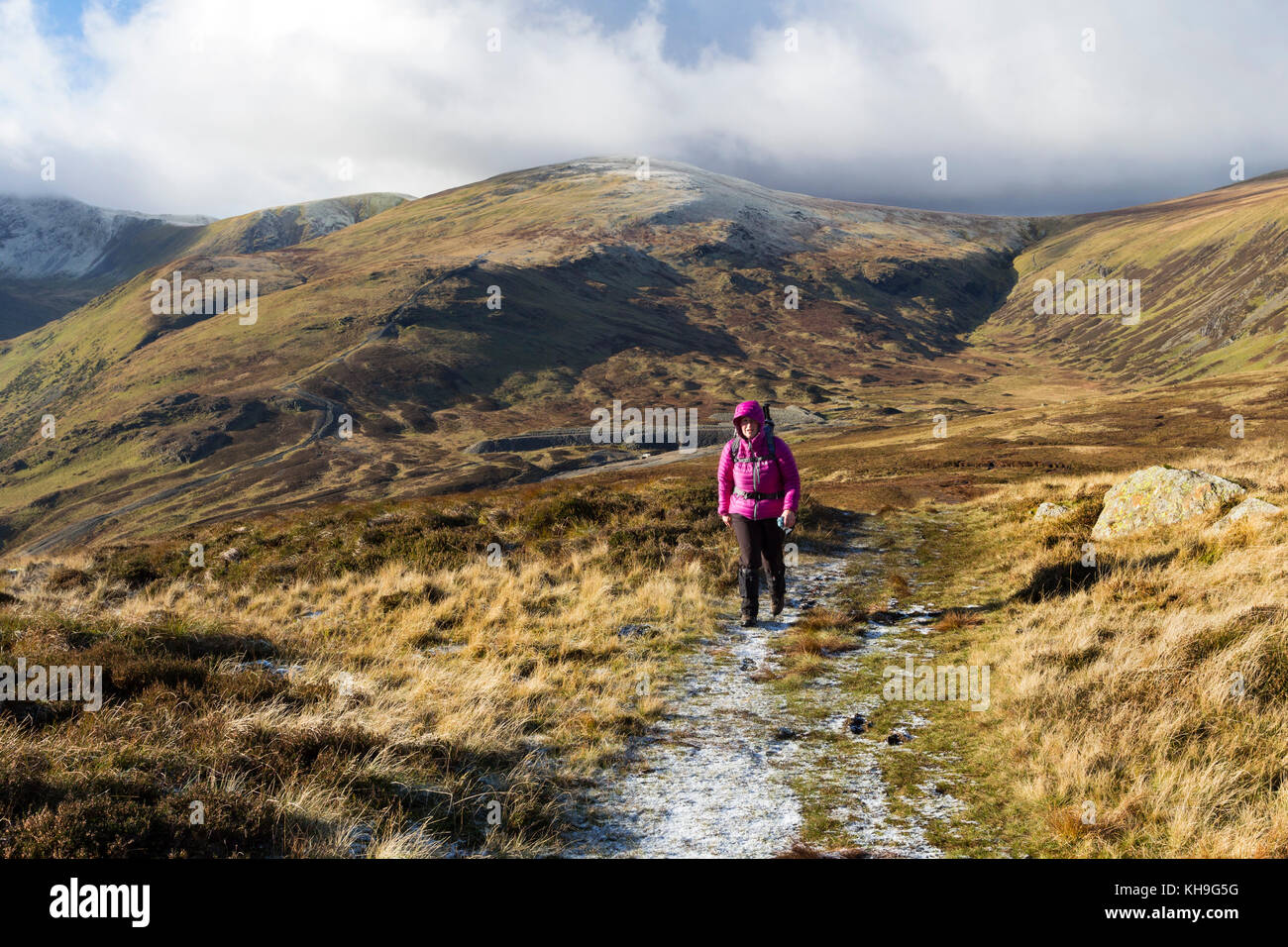 Walker Ascending Sheffield Pike with the Mountain of Raise Behind, Lake District, Cumbria UK. Stock Photo