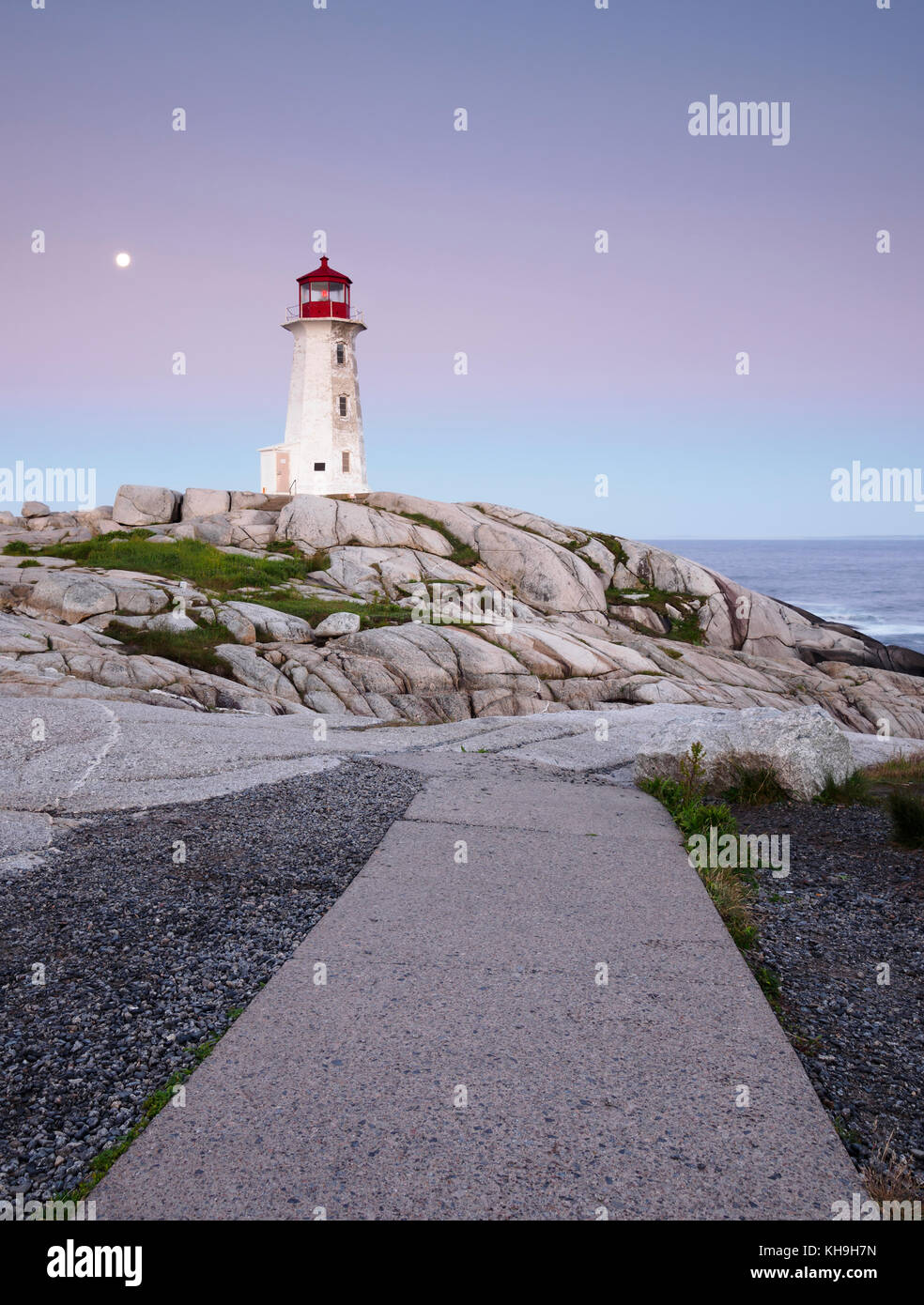Lighthouse and granite rock formations at Peggy’s Cove, Nova Scotia Stock Photo