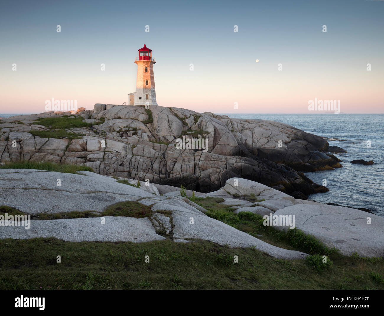 Lighthouse and granite rock formations at Peggy’s Cove, Nova Scotia Stock Photo