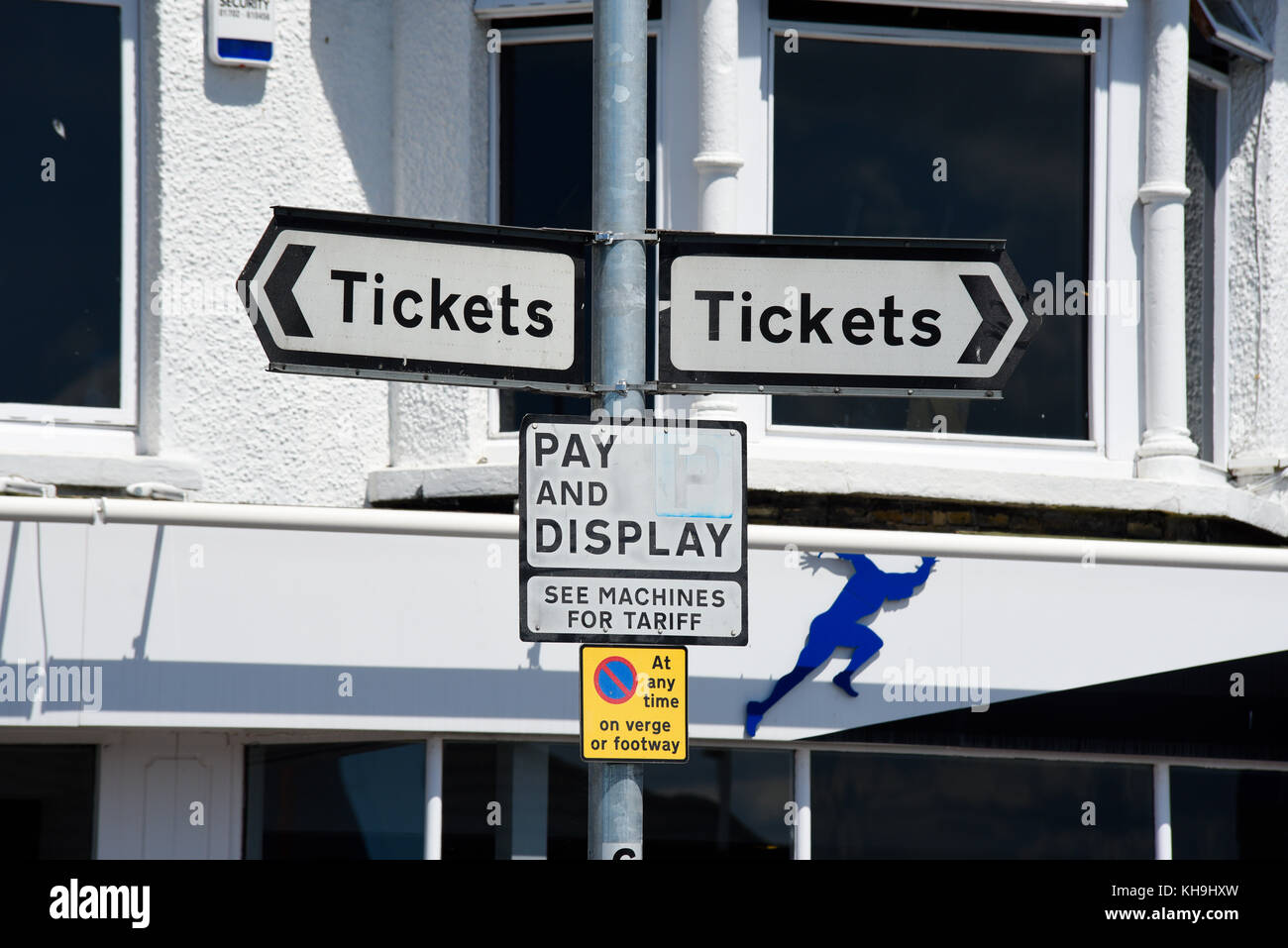Tickets signs for pay and display parking meters. Opposite directions