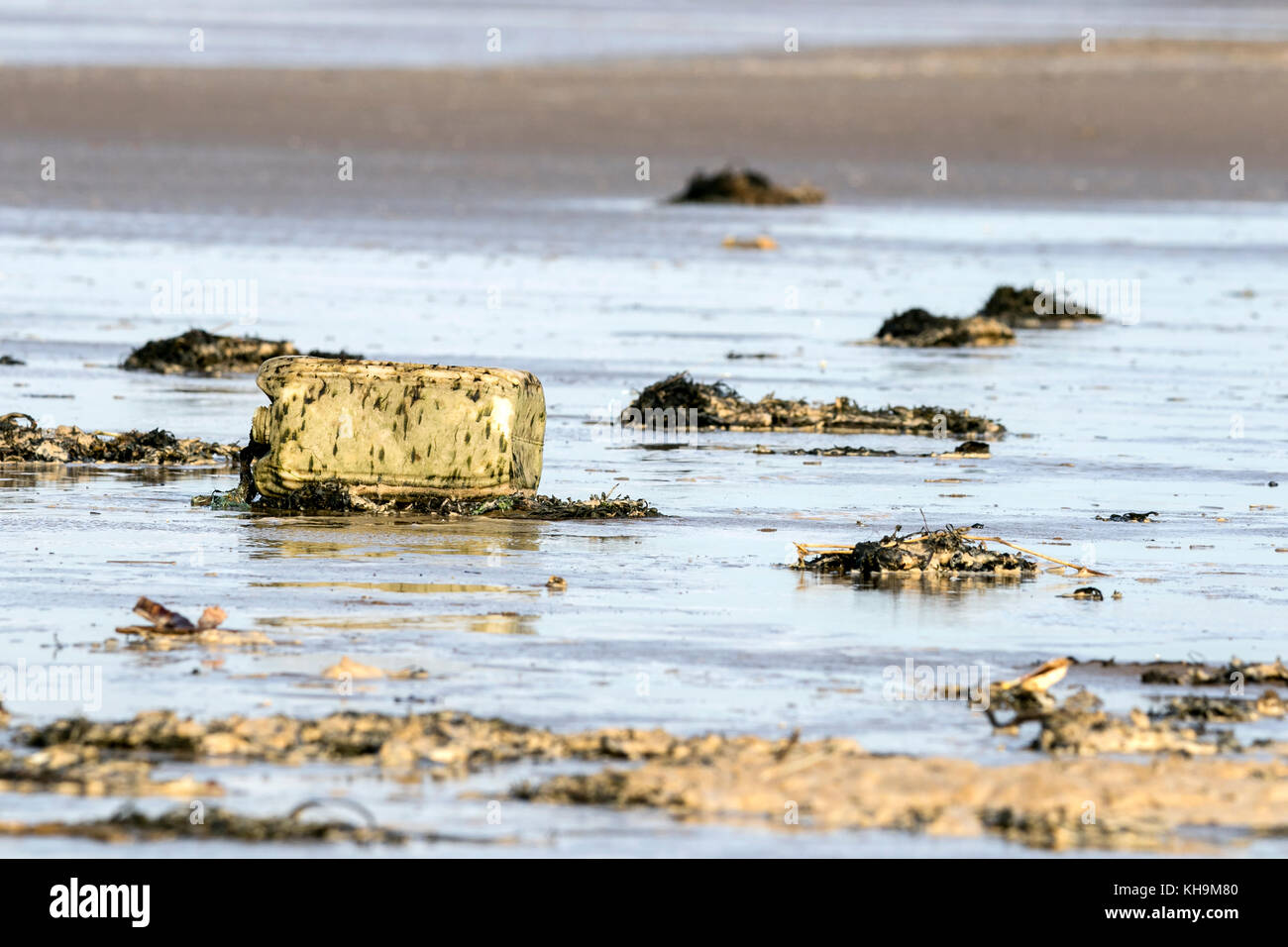 Discarded plastic products washed up on to Southport beach in Merseyside. Stock Photo