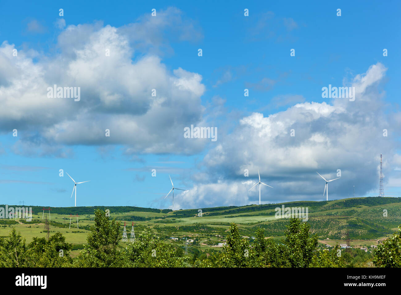 Modern windmills produce electricity along the roads of wind