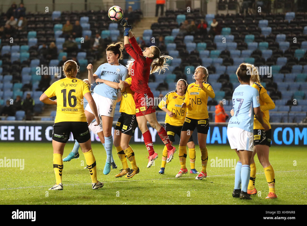 LSK Kvinner goalkeeper Cecilie Fiskerstrand punches the ball clear under pressure from Manchester City's Jennifer Beattie during the UEFA Women's Champions League match at the City Football Academy Stadium, Manchester. Stock Photo