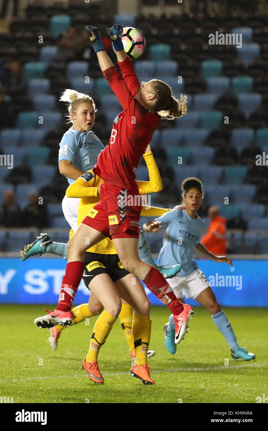 LSK Kvinner goalkeeper Cecilie Fiskerstrand punches the ball clear under pressure from Manchester City's Isobel Christiansen during the UEFA Women's Champions League match at the City football Academy Stadium, Manchester. Stock Photo