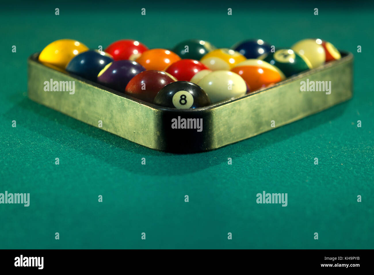 Horizontal photo of a billiard table with the billiard balls arranged in a triangle Stock Photo