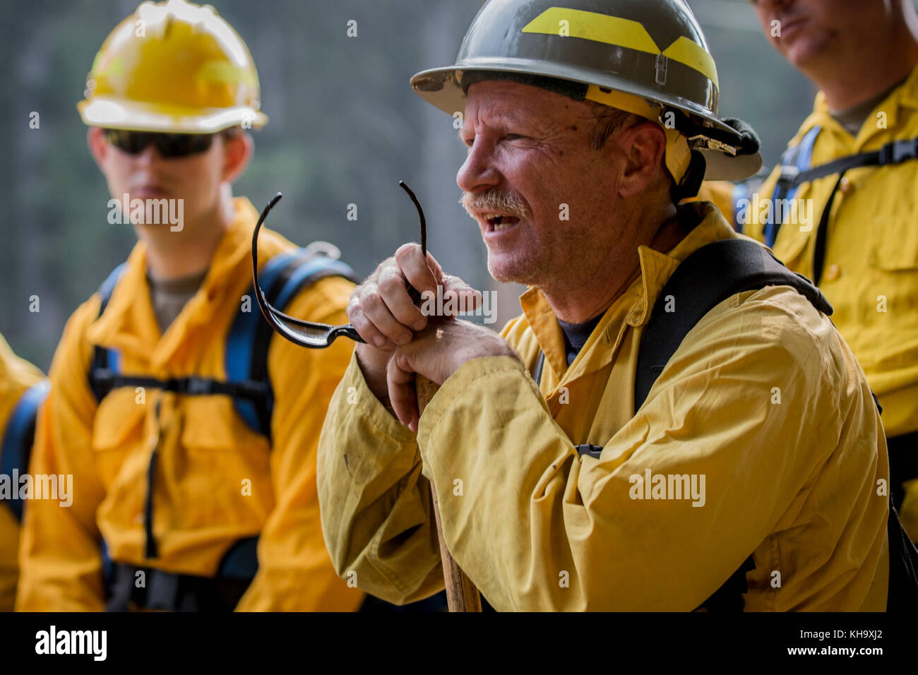 Wildland firefighters share their wisdom during tactical training with Soldiers, assigned to 23rd Brigade Engineer Battalion, 1-2 Stryker Brigade Combat Team, at the Umpqua North Complex, Oregon, Sept. 9. The training will prepare the Soldiers with the skills necessary to safely and effectively assist firefighter in the containment of the wild fires currently active in the Pacific Northwest. (U.S. Army photos by Pvt. Adeline Witherspoon, 20th Public Affairs Detachment) Stock Photo