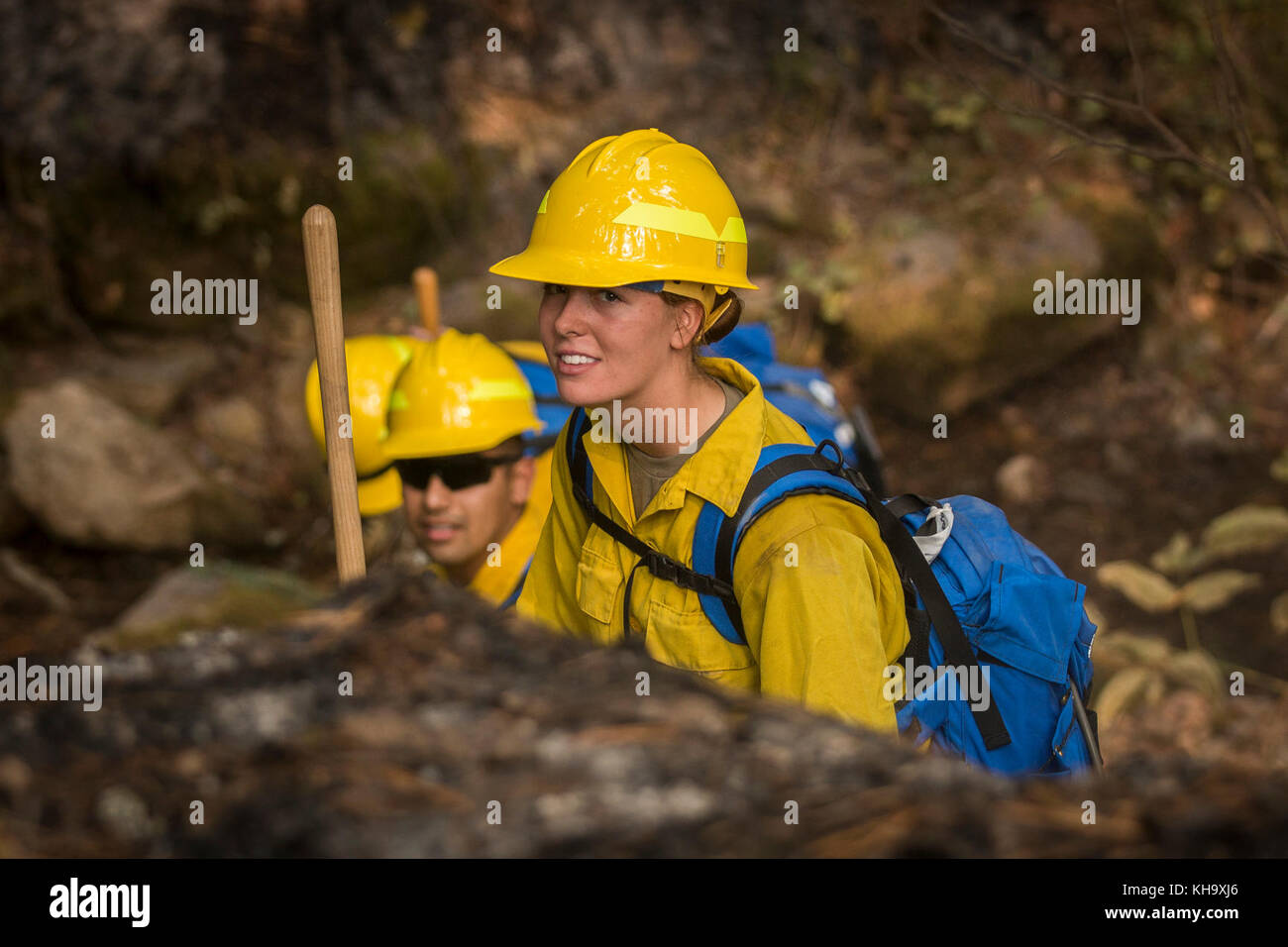A U.S. Army Soldier assigned to 23rd Brigade Engineer Battalion, 1-2 Stryker Brigade Combat Team, completes initial tactical training with civilian firefighters working with the U.S. Forest Service in the Umpqua National Forest, Umpqua North Complex, Oregon, Sept. 8. The Soldiers were taught to check for hot spots under the scorched forest floor, by feeling for heat with the backs of their hands. This technique is known as cold trailing. (U.S. Army photos by Pvt. Adeline Witherspoon, 20th Public Affairs Detachment) Stock Photo