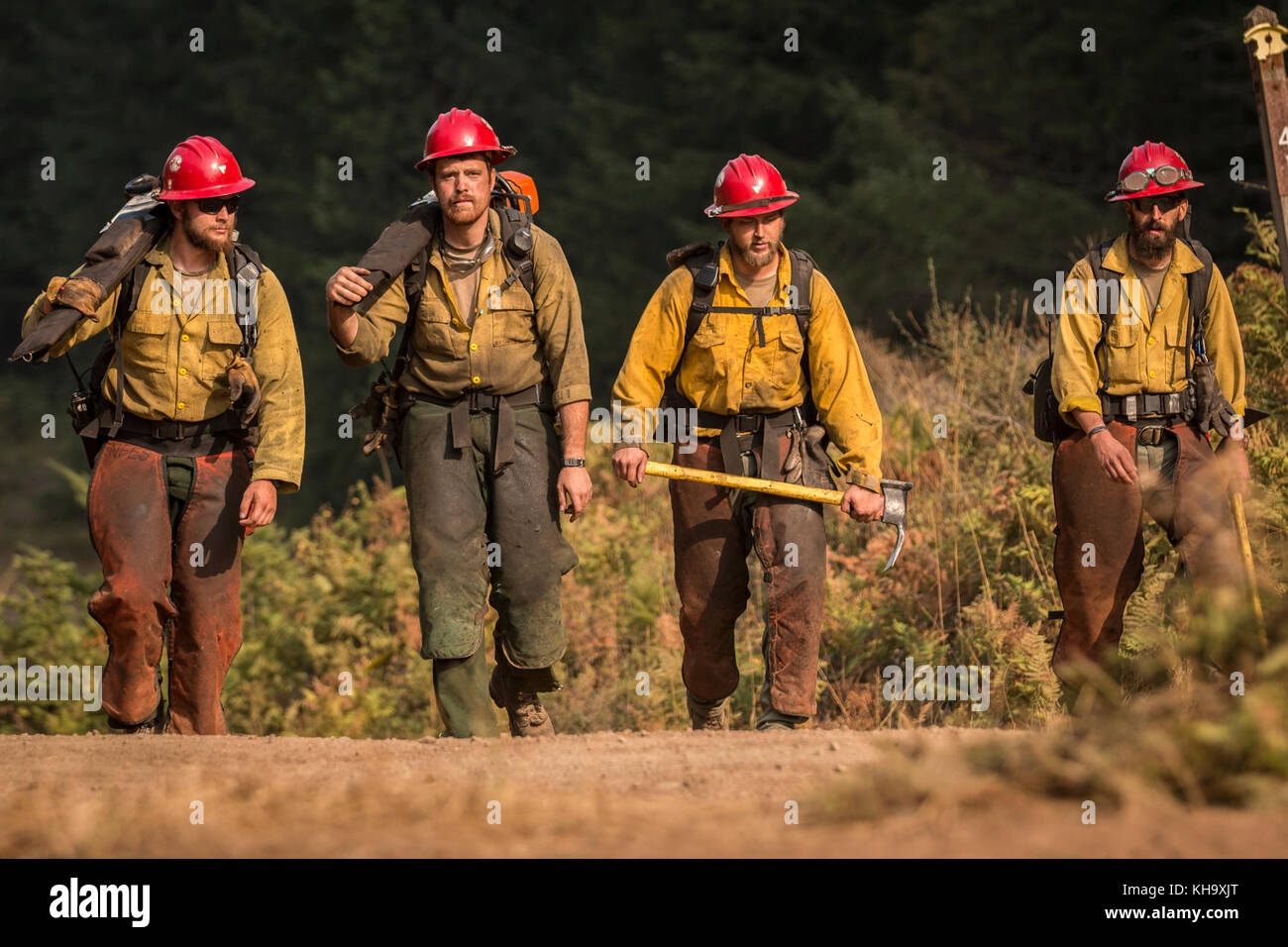 Firefighters with the Devil's Canyon Hand Crew, calls it a day after supervising tactical training with the Soldiers assigned to 23rd Brigade Engineer Battalion, 1-2 Stryker Brigade Combat Team, Umpqua North Complex, Oregon, Sept. 8. The Devil's Canyon Hand Crew is an all-veteran wildland firefighting crew based out of Worland, Wyoming. (U.S. Army photo by Pvt. Adeline Witherspoon, 20th Public Affairs Detachment) Stock Photo
