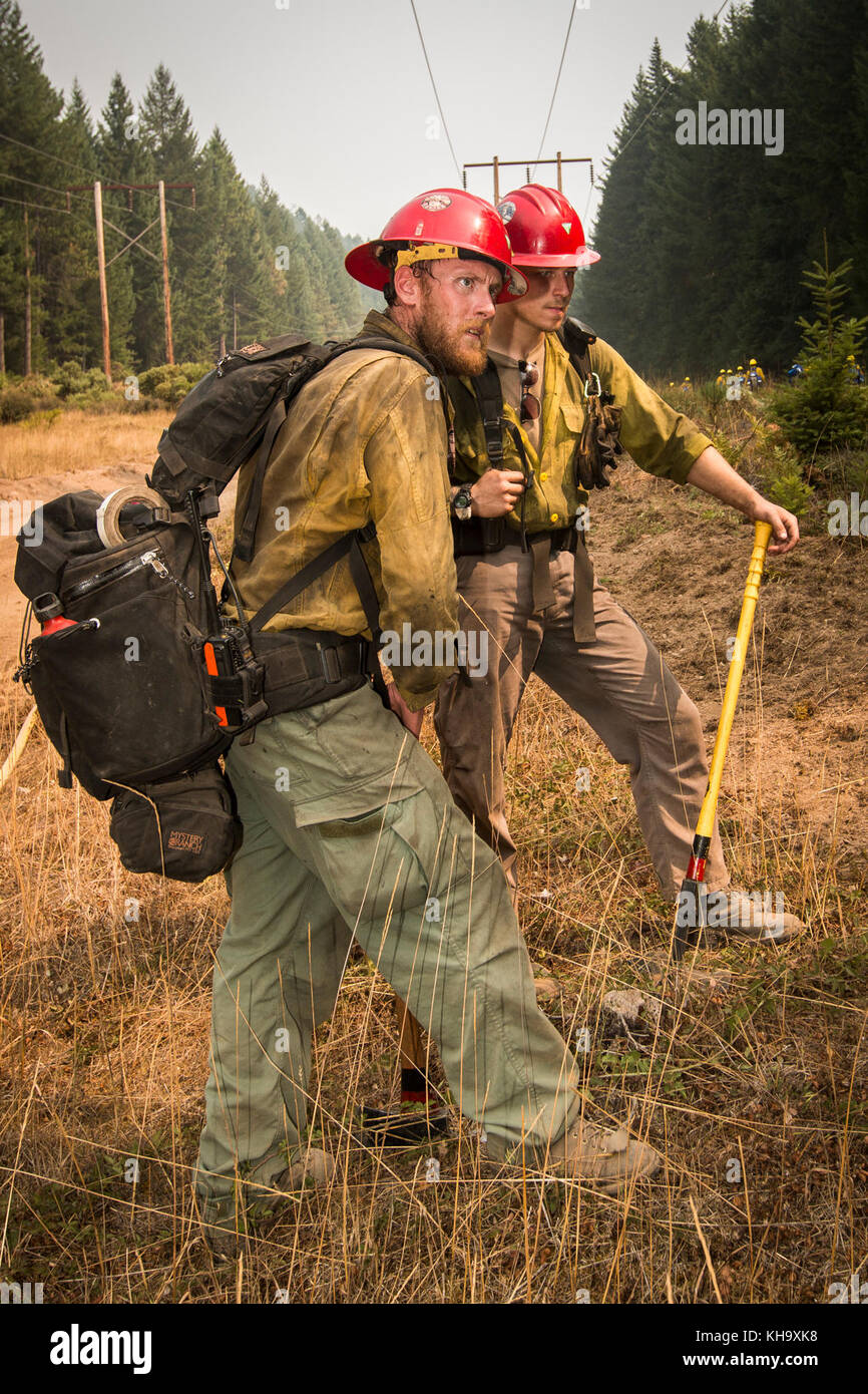 Zane Willert, a firefighter with the Devil's Canyon Handcrew, supervises tactical training with the Soldiers assigned to 23rd Brigade Engineer Battalion, 1-2 Stryker Brigade Combat Team, Umpqua North Complex, Oregon, Sept. 8. When not fighting the flames during wildfire season, Willert is a cattle rancher in Wyoming. (U.S. Army photo by Pvt. Adeline Witherspoon, 20th Public Affairs Detachment) Stock Photo