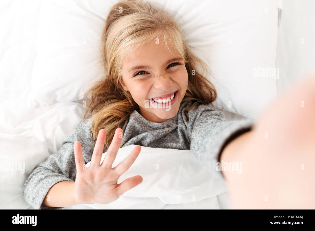 Blonde girl taking a selfie with her hair down - wide 1