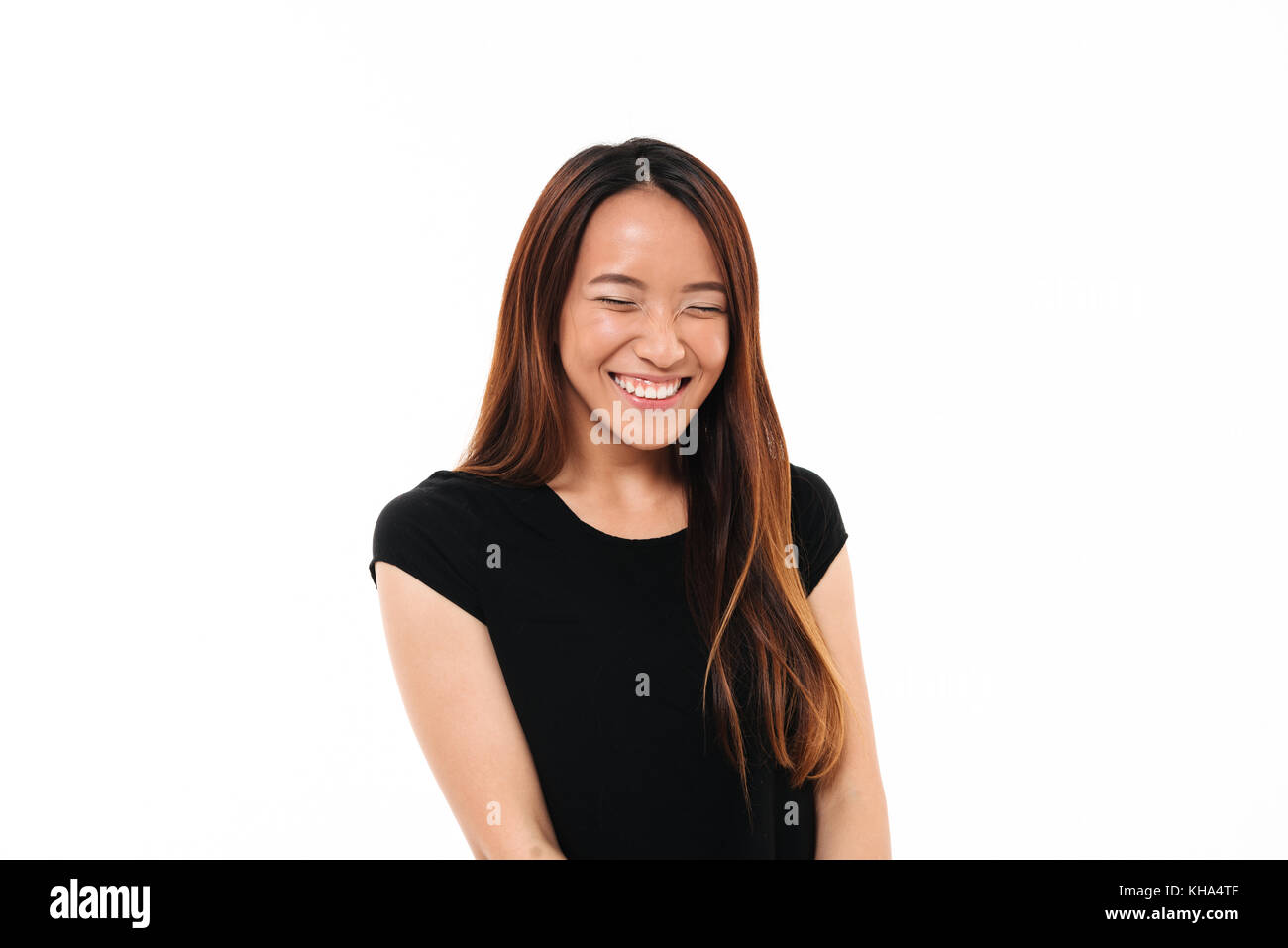 Close-up portrait of laughing attractive asian woman with closed eyes ...