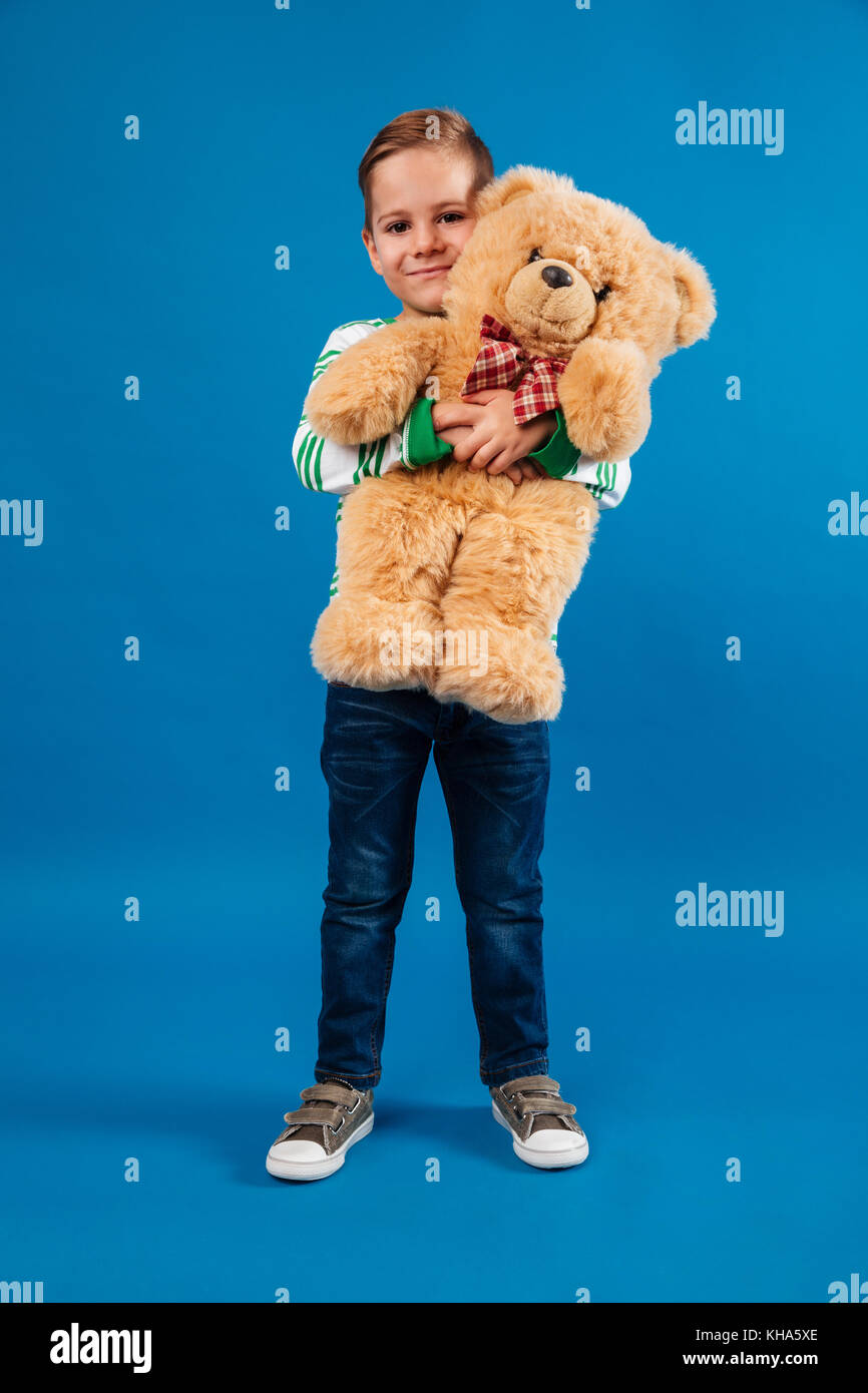 Boy hugging teddy bear hi-res stock photography and images - Alamy