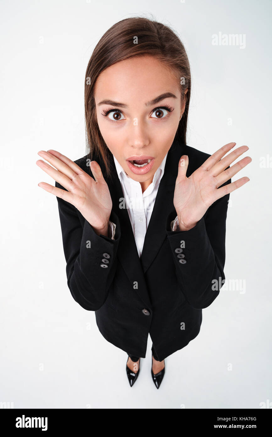 Photo of shocked surprised business woman standing isolated over white ...