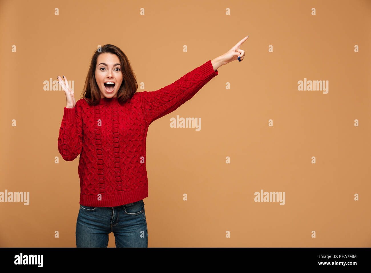 Image of shocked caucasian woman dressed in sweater standing isolated