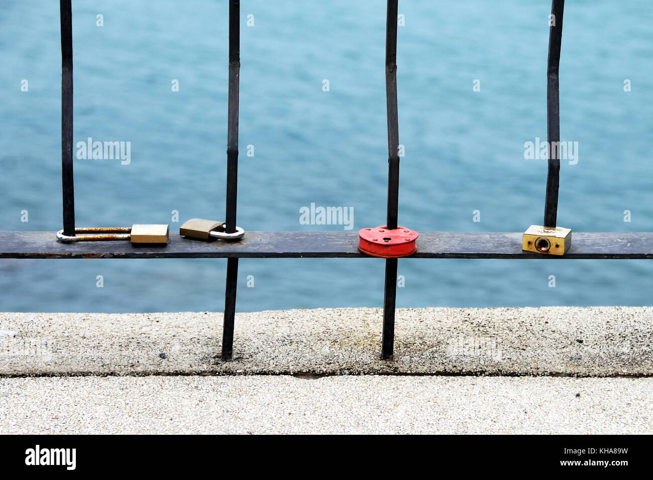 Padlocks locked on bridge as symbol of eternal love Stock Photo