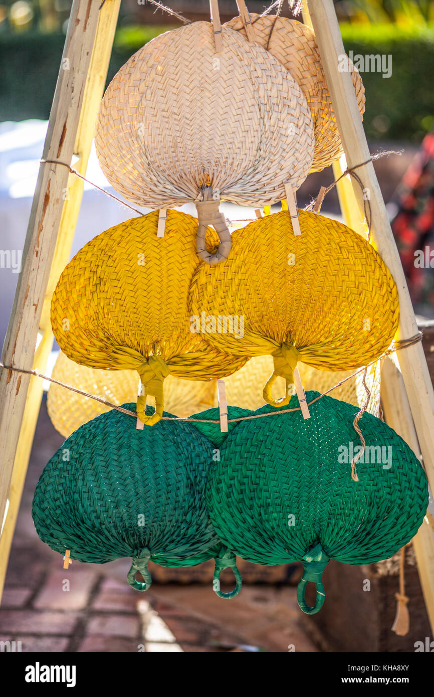 Setting of handheld fans for wedding guests. Esparto fiber Stock Photo