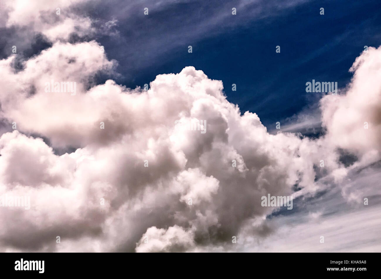 White cumulus clouds against a blue sky background Stock Photo - Alamy