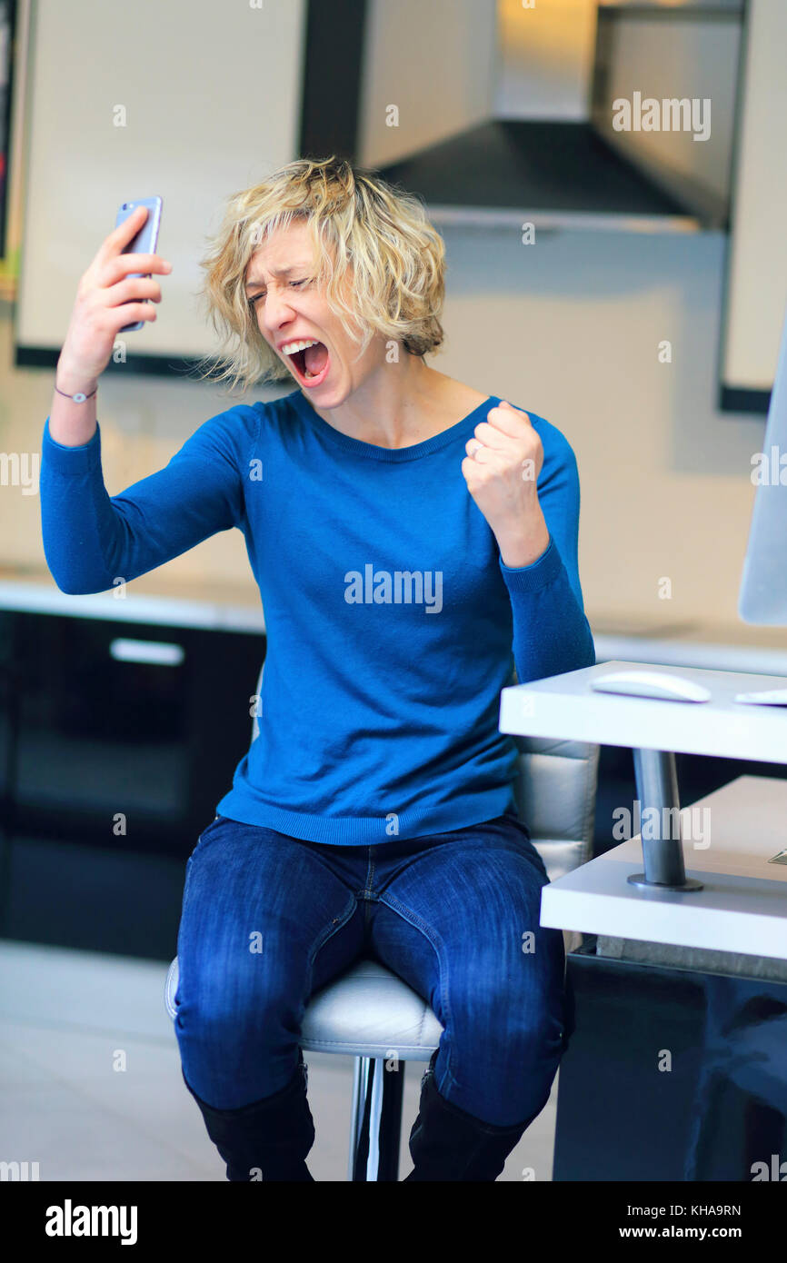 Woman at home. Phone problems Stock Photo - Alamy