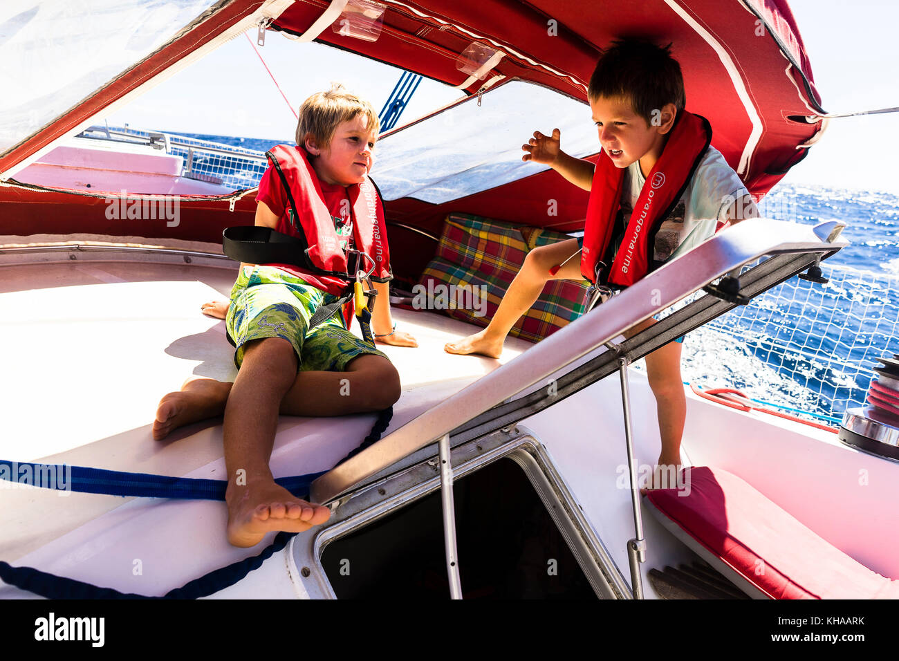 Two boys 5 and 7 years old are playing on a ship, Saint-Pierre, Martinique, France Stock Photo