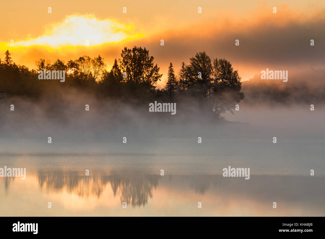Foggy sunrise, Simon Lake, Naughton, City of Greater Sudbury, Ontario, Canada Stock Photo