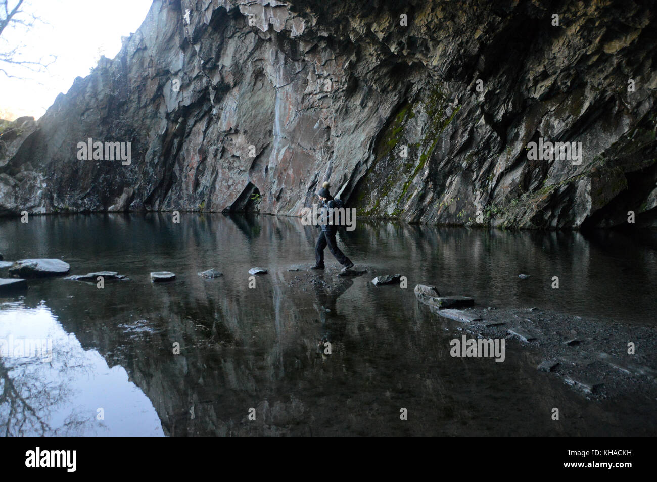 Lone Woman Fell Walker in Rydal Cave Walking on Stepping Stones above