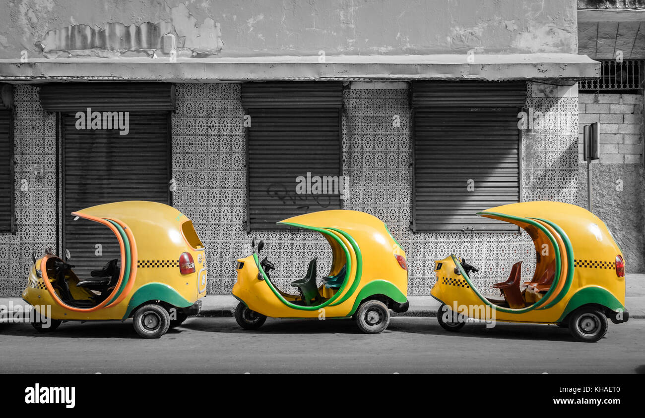 Small cuban coco taxis in line Stock Photo