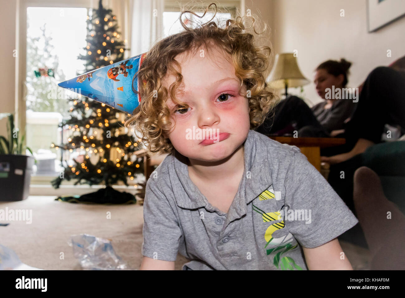unhappy boy at Christmas Stock Photo