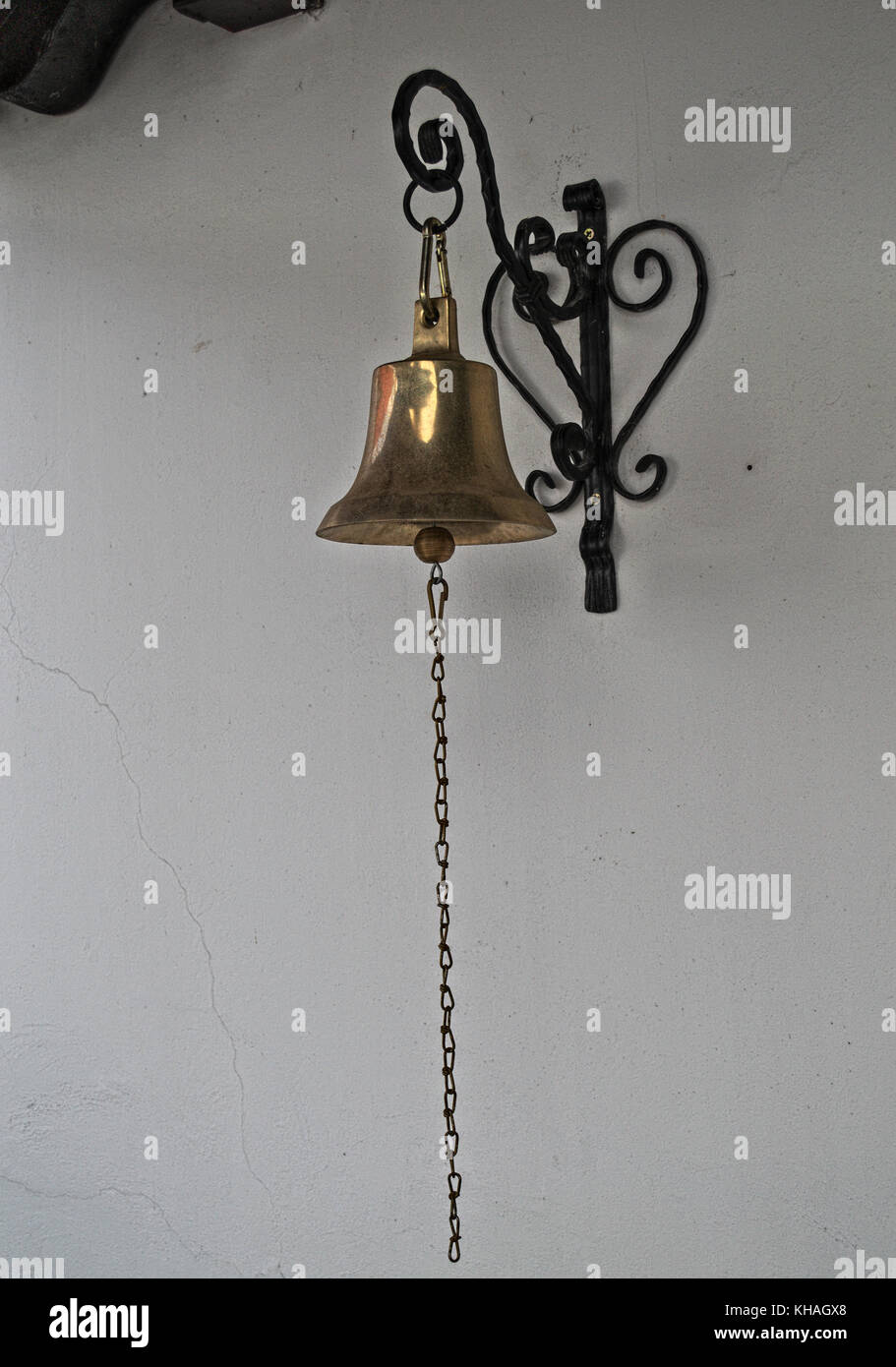 Bell hanging on wall Stock Photo Alamy