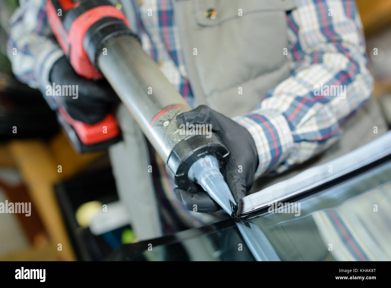 Man using industrial sized sealant gun Stock Photo Alamy