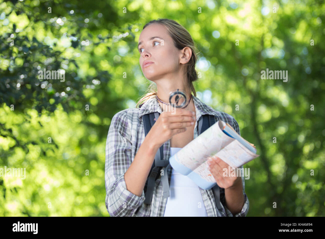 female hiker deciding which path to take Stock Photo