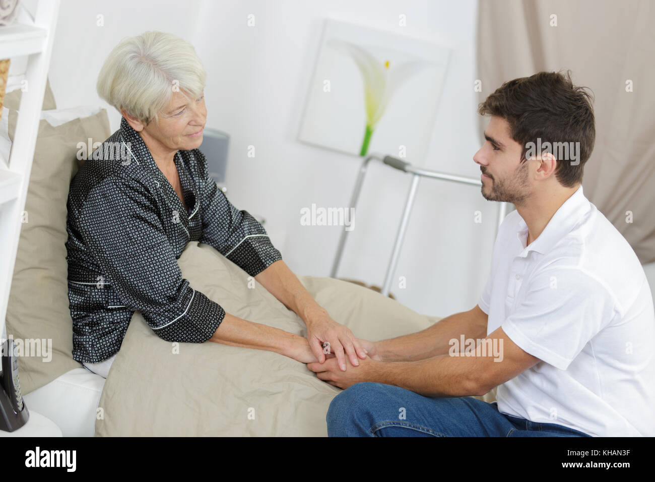 visiting the sick mother Stock Photo