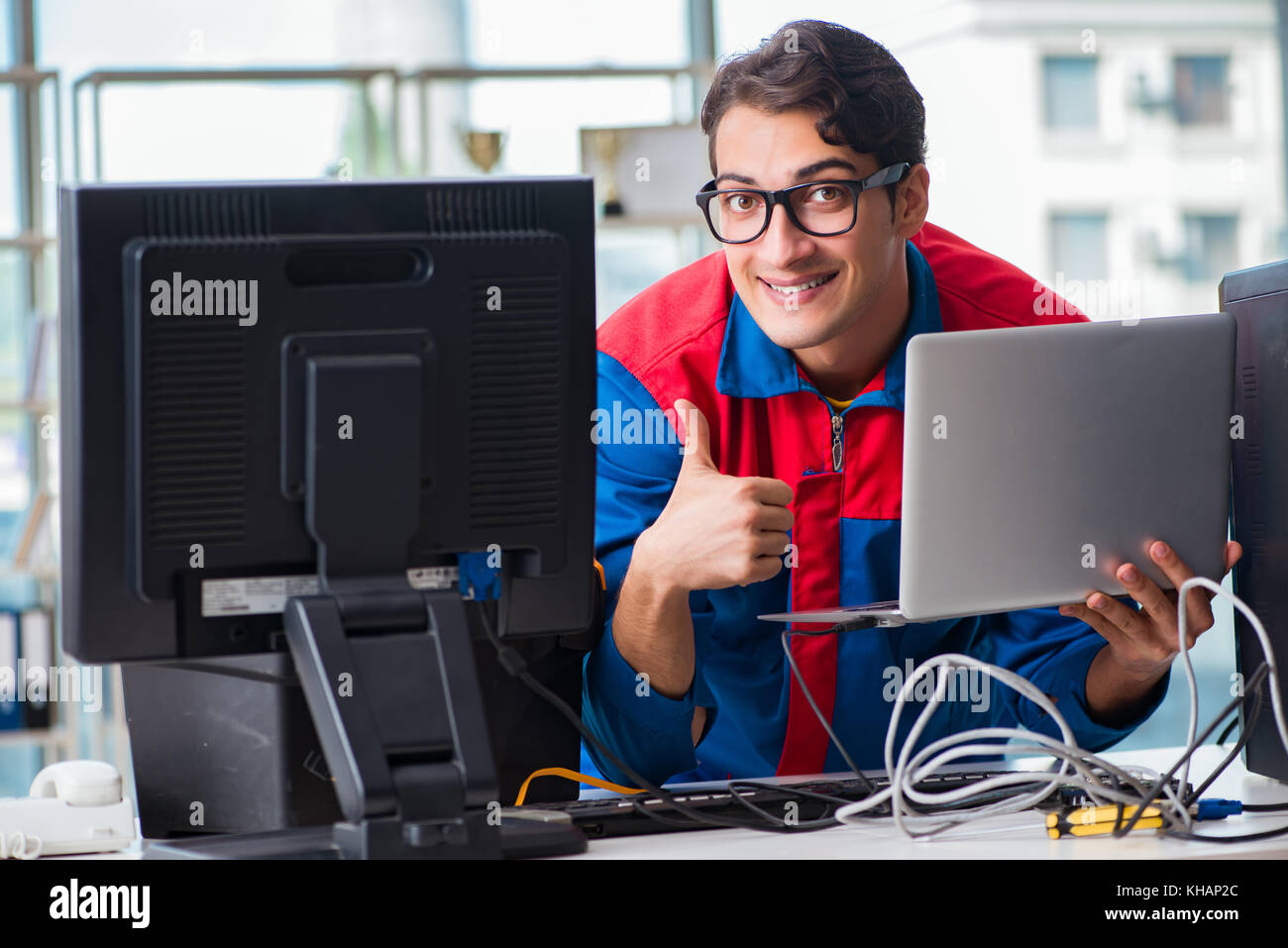 Computer Rebort Man Computer repairman working on repairing computer in IT workshop Stock ...