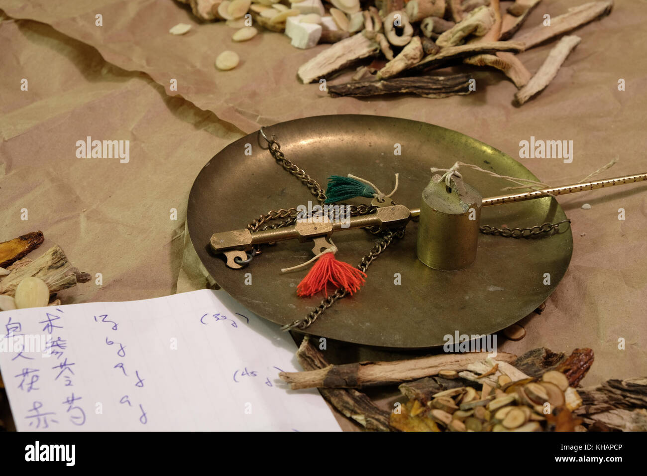 Chinese herbal medicine with written prescription in Chinese characters