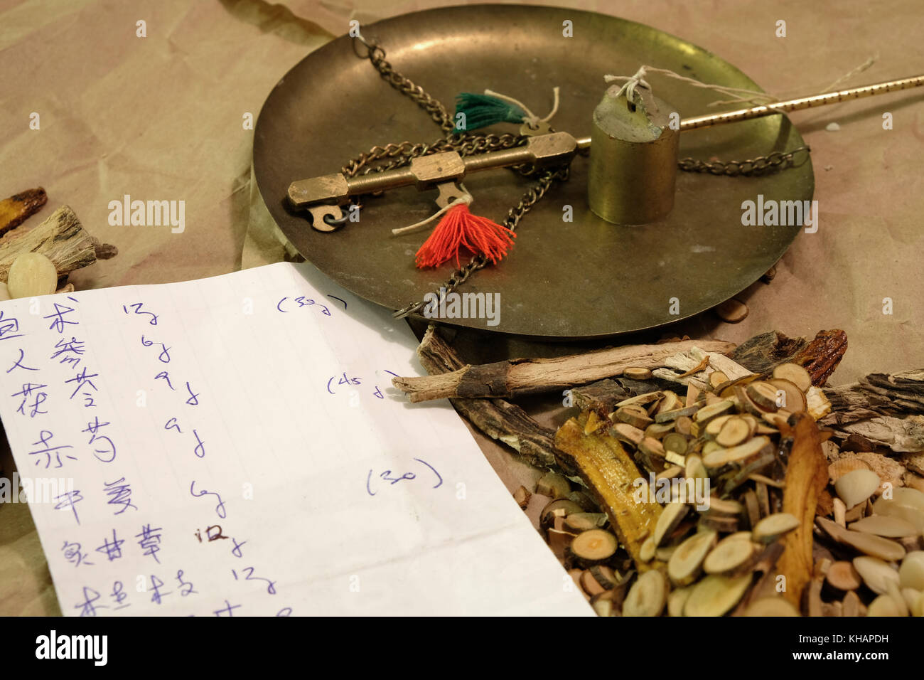 Chinese herbal medicine with written prescription in Chinese characters