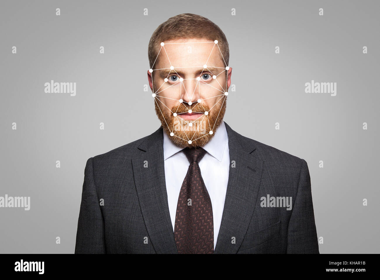 Biometric verification - businessman face recognition. Technology of face recognition on polygonal grid is constructed by the points of IT security an Stock Photo