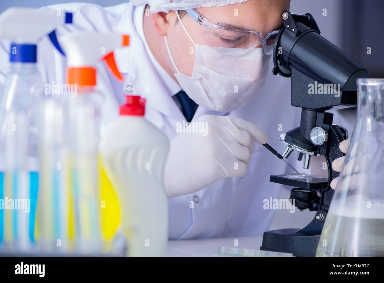 Man in the lab testing new cleaning solution detergent Stock Photo Alamy