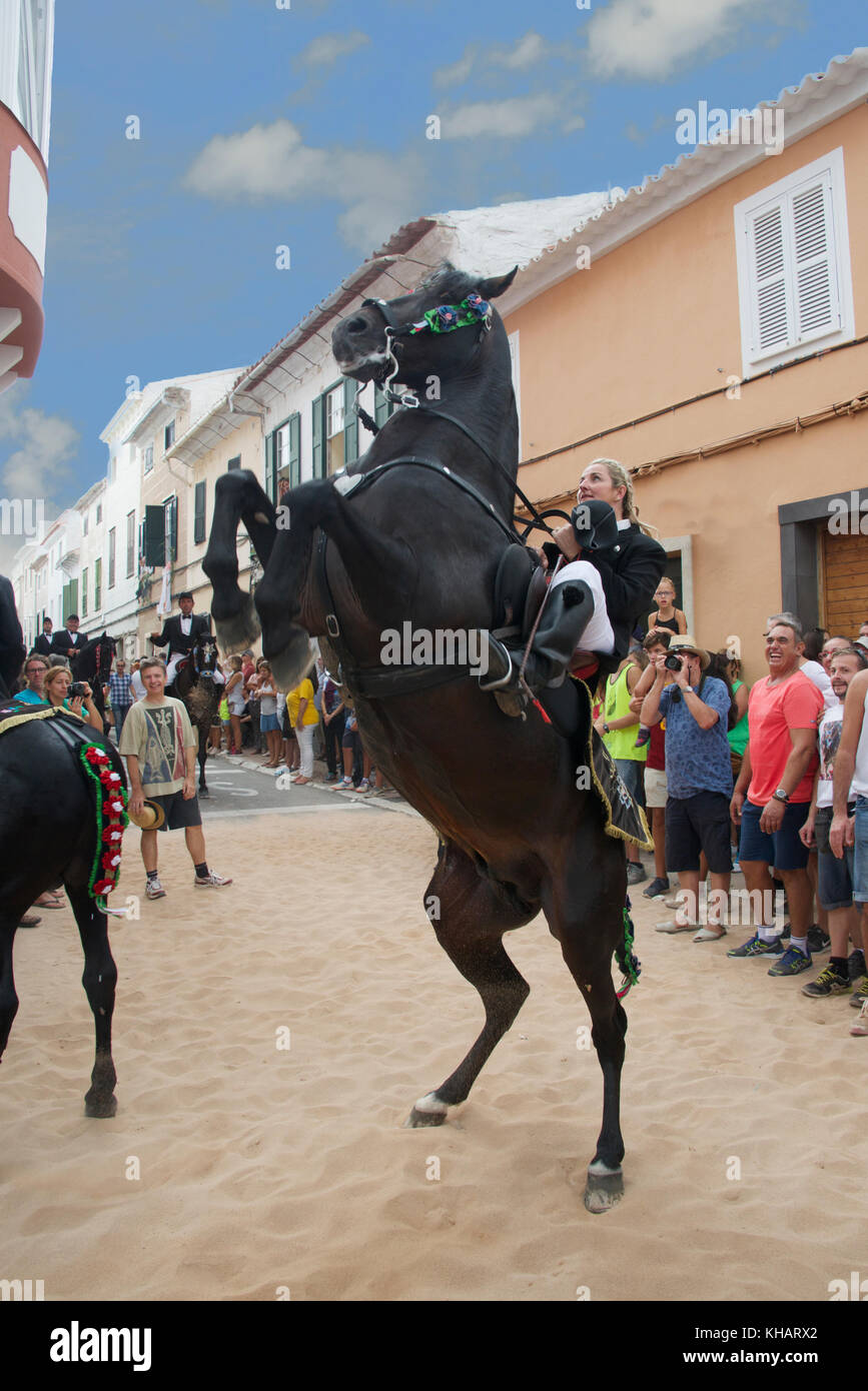 Female horse rider or Caixer  with rearing horse Mare de Deu de Gràcia Mao Menorca Spain Stock Photo