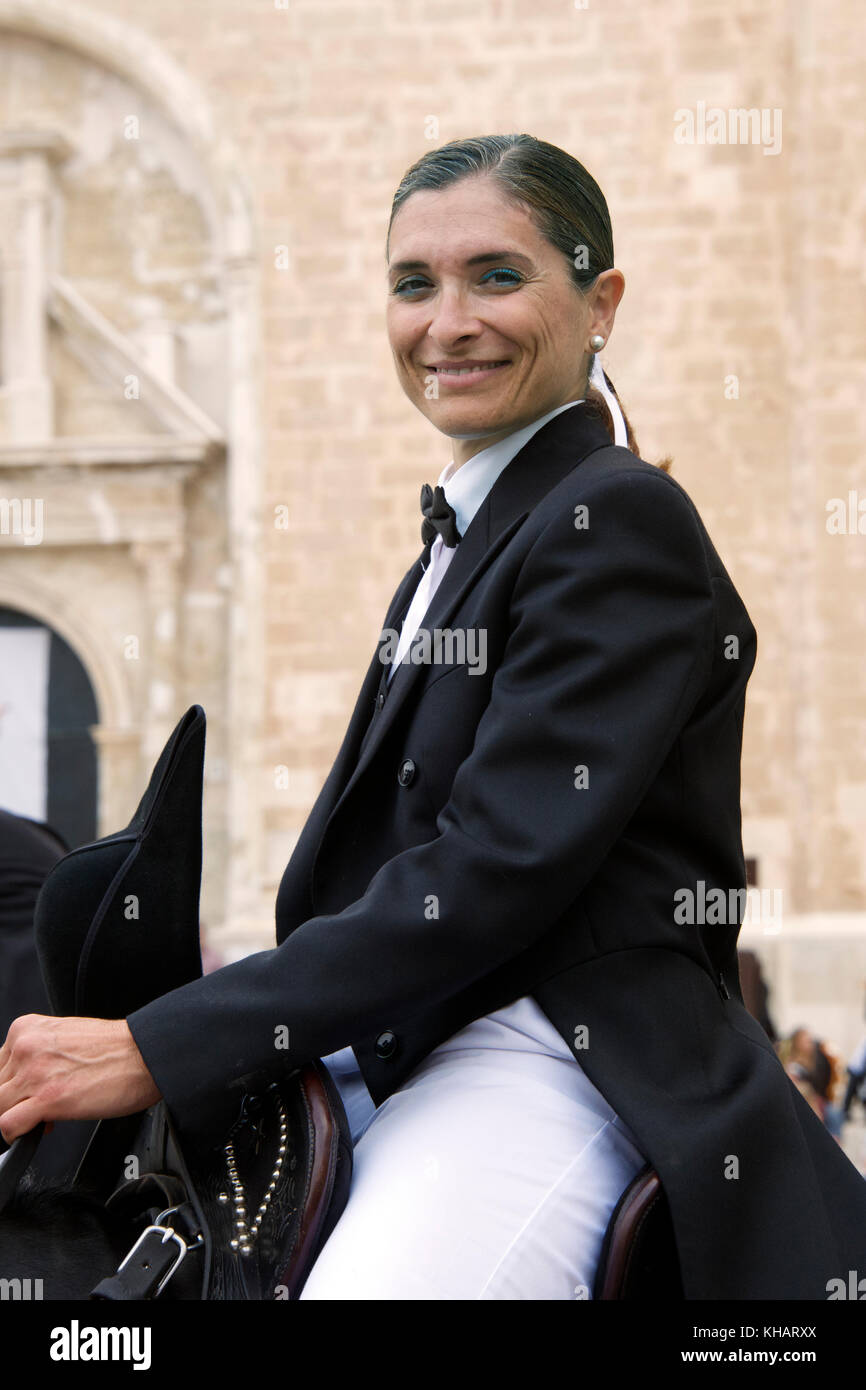 Portrait female horse rider or Caixer in traditional costume Mare de Deu de Gràcia Mao Menorca Spain Stock Photo