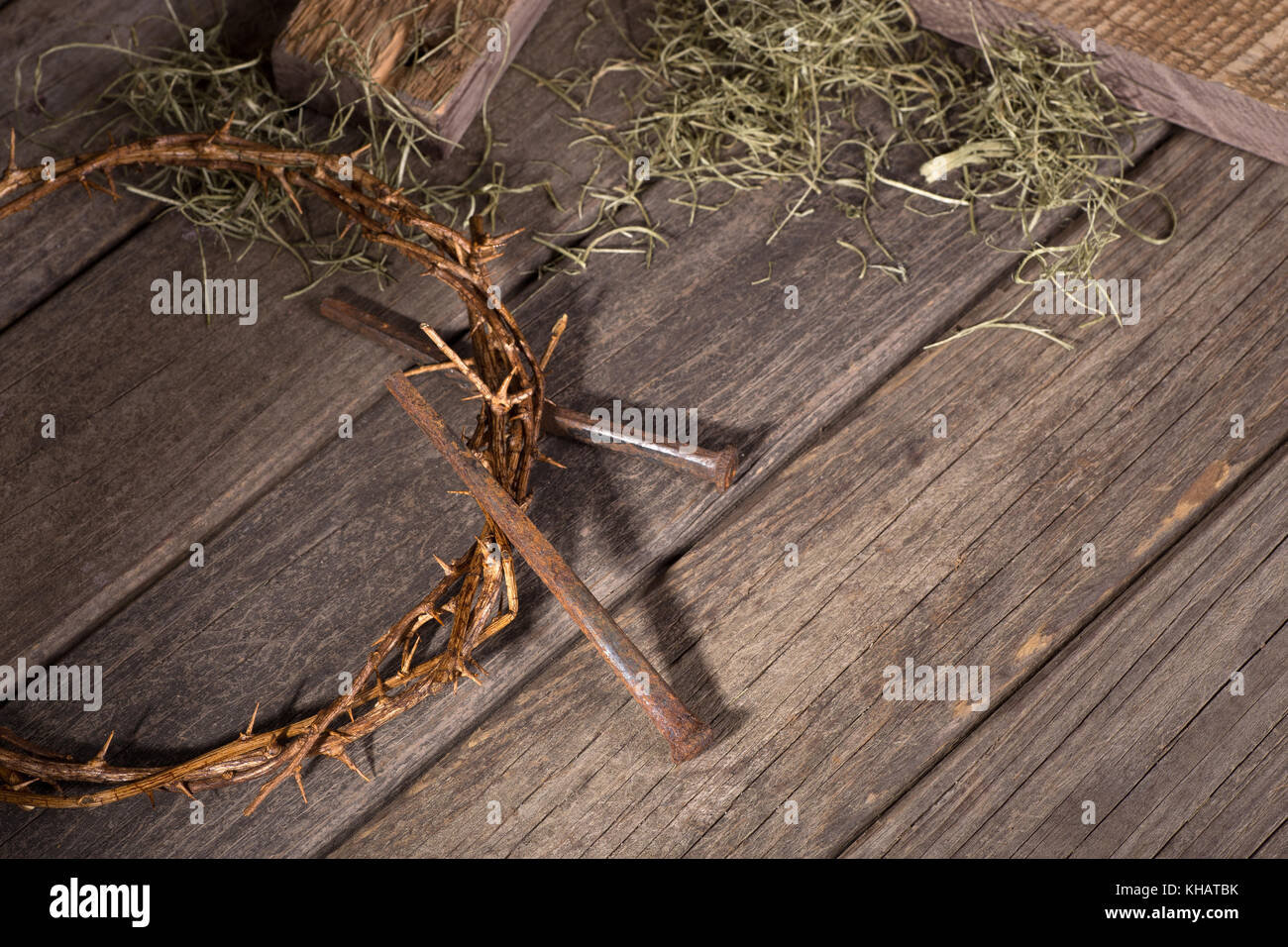 Crown of thorns and nails on a wood surface Stock Photo - Alamy