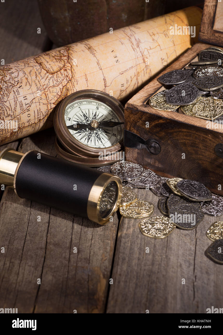 Treasure of gold and silver coins with telescope, compass and map Stock ...