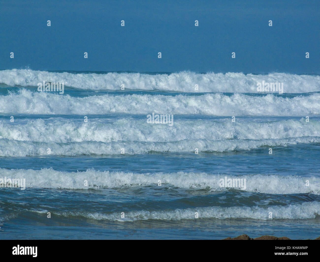 Rolling wave breakers off the shoreline at Newquay, Cornwall. Stock Photo