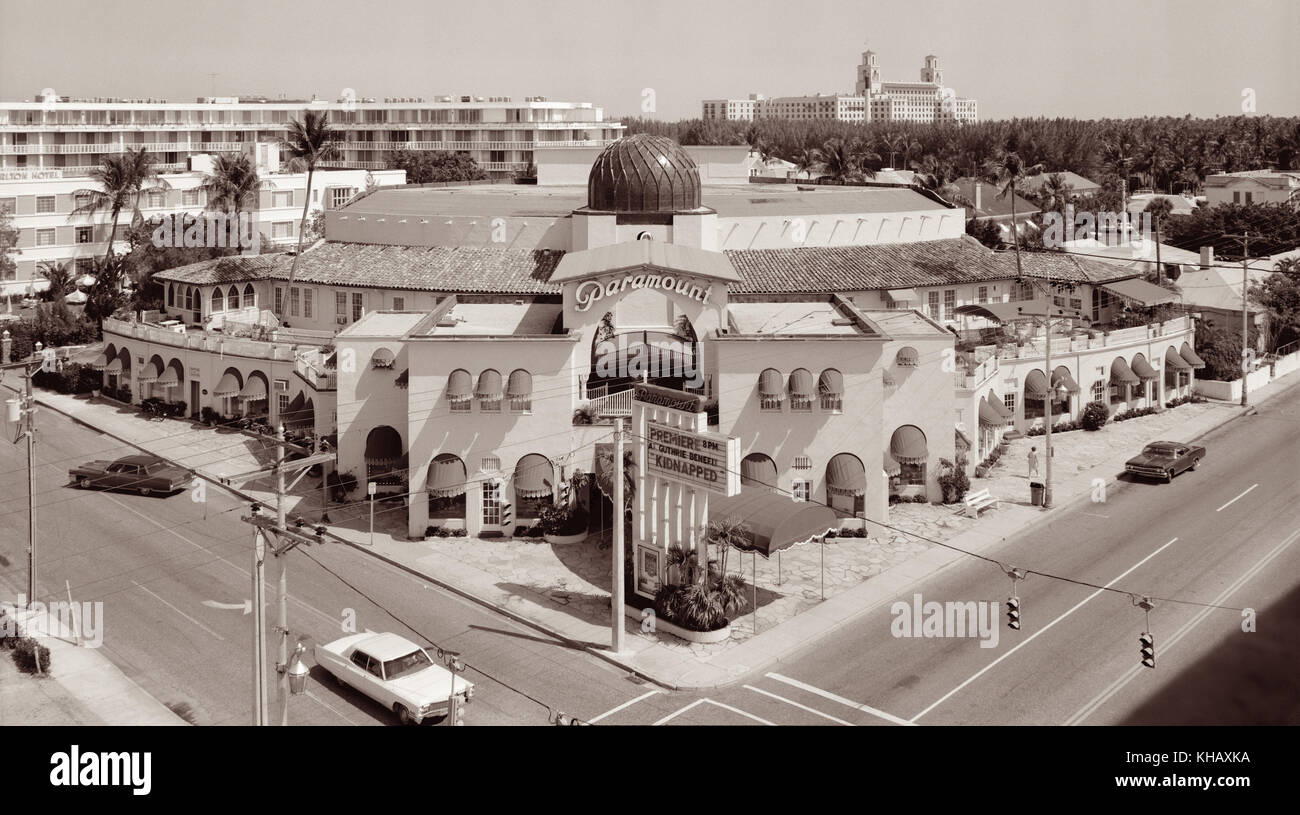 The Paramount Theatre in Palm Beach, Florida with The Breakers Resort seen in the background (right). The historic movie palace was built in 1926 and designed in the Moorish Revival and Spanish Colonial Revival style by Joseph Urban as a silent movie theater just prior to the advent of 'talkies'. (Photo c1972) Stock Photo