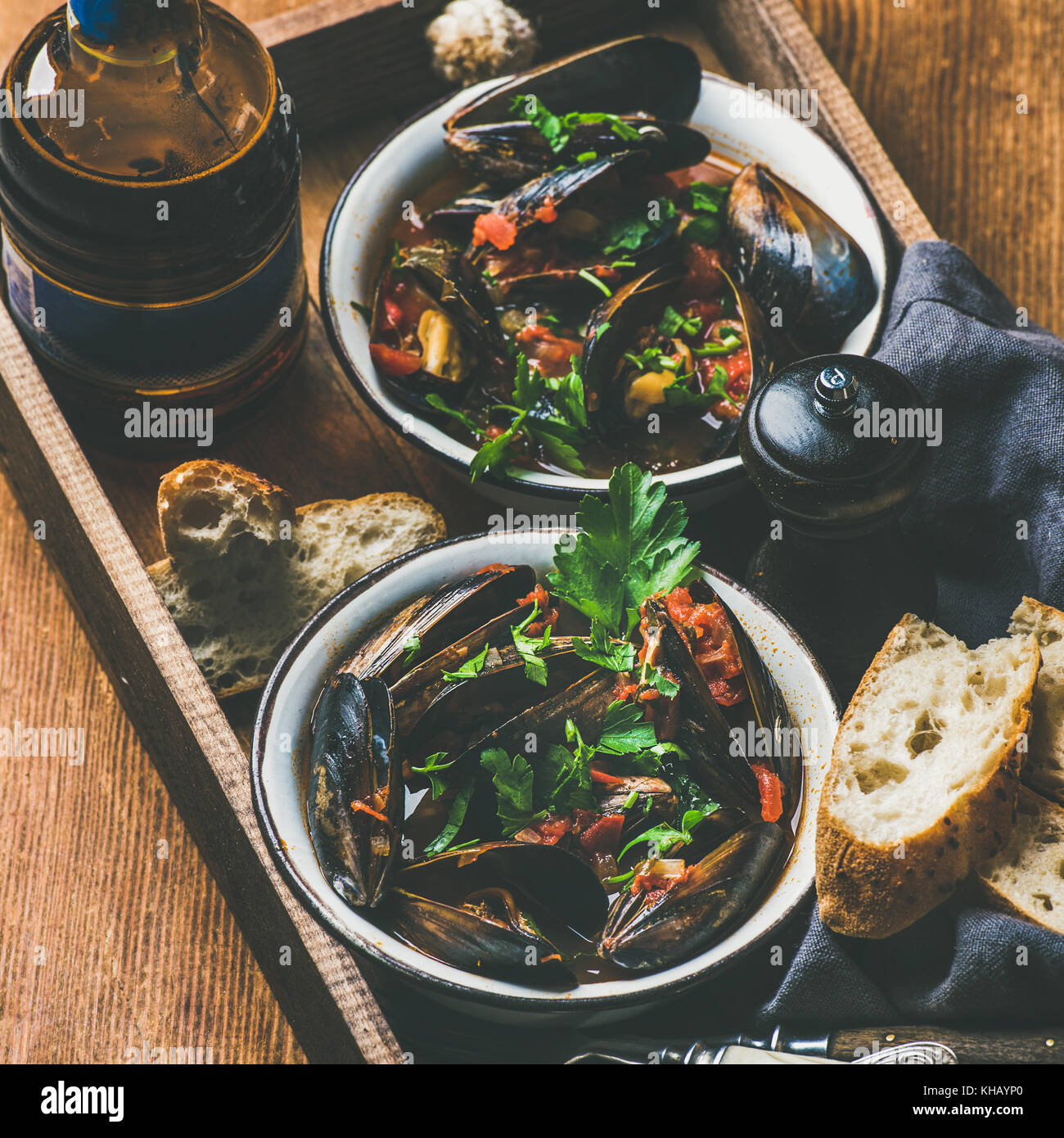 Belgian boiled mussels in and light beer in bottle Stock Photo Alamy