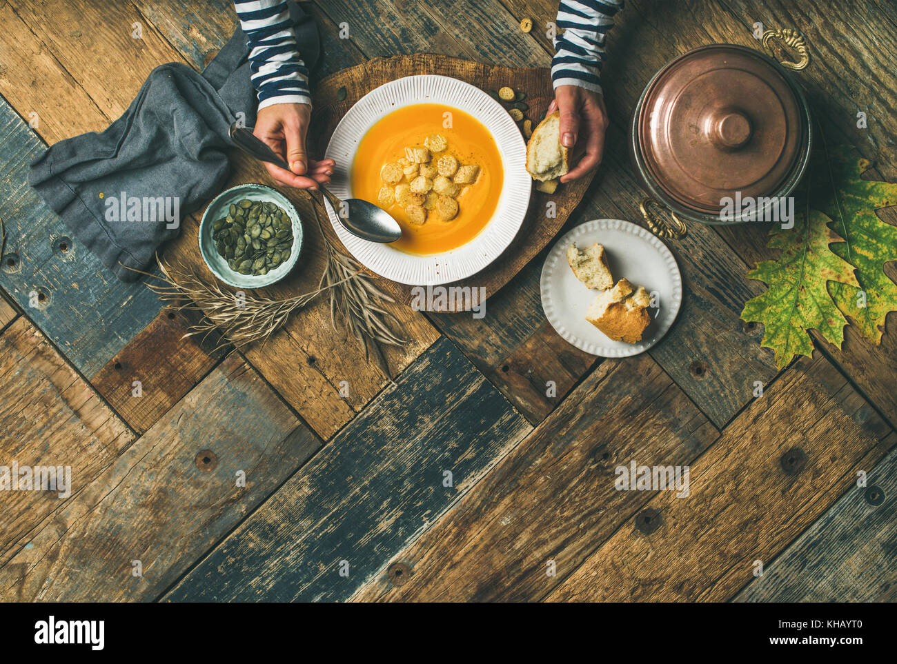 Fall warming pumpkin cream soup, copy space Stock Photo