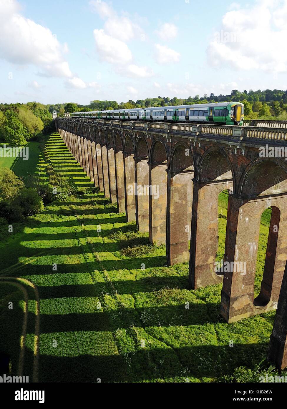 Train over bridge sussex Stock Photo
