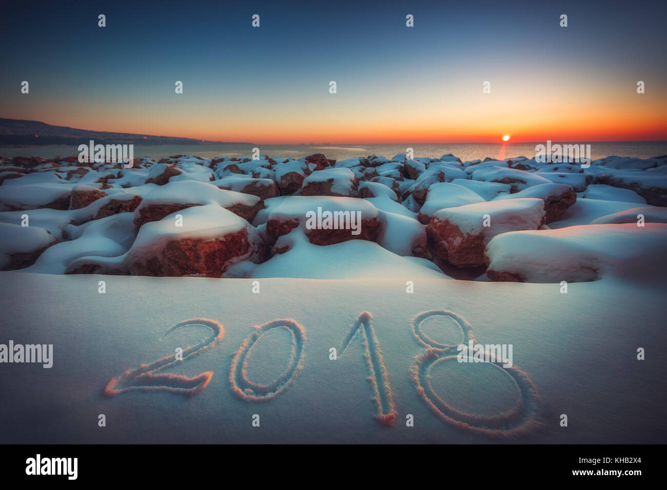 New Year 2018. Written 2018 on the snow beach. Concept of New Year. Stock Photo