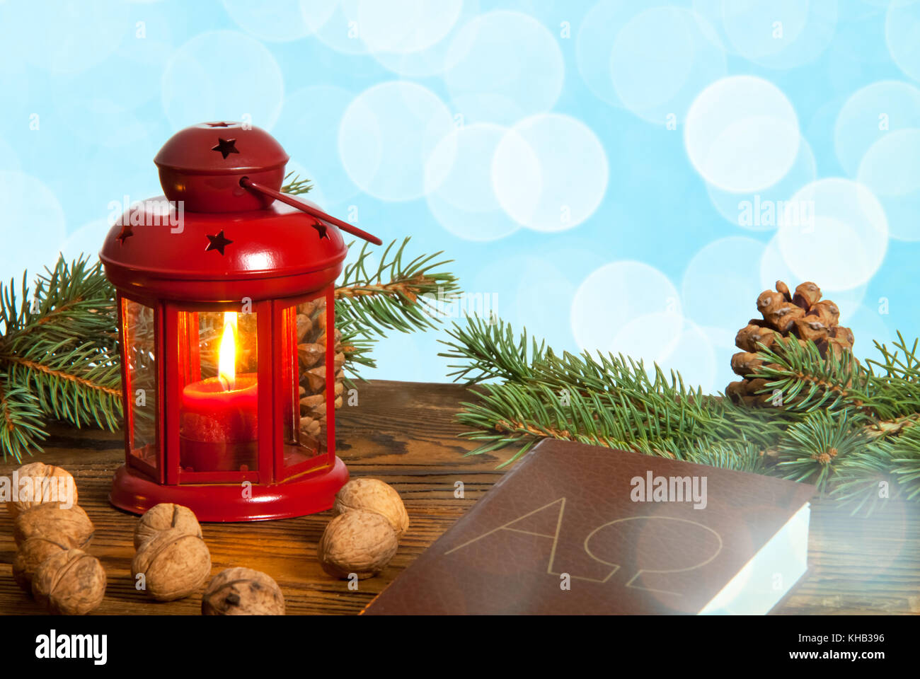 Still life with red lanter, walnuts and bible Stock Photo Alamy