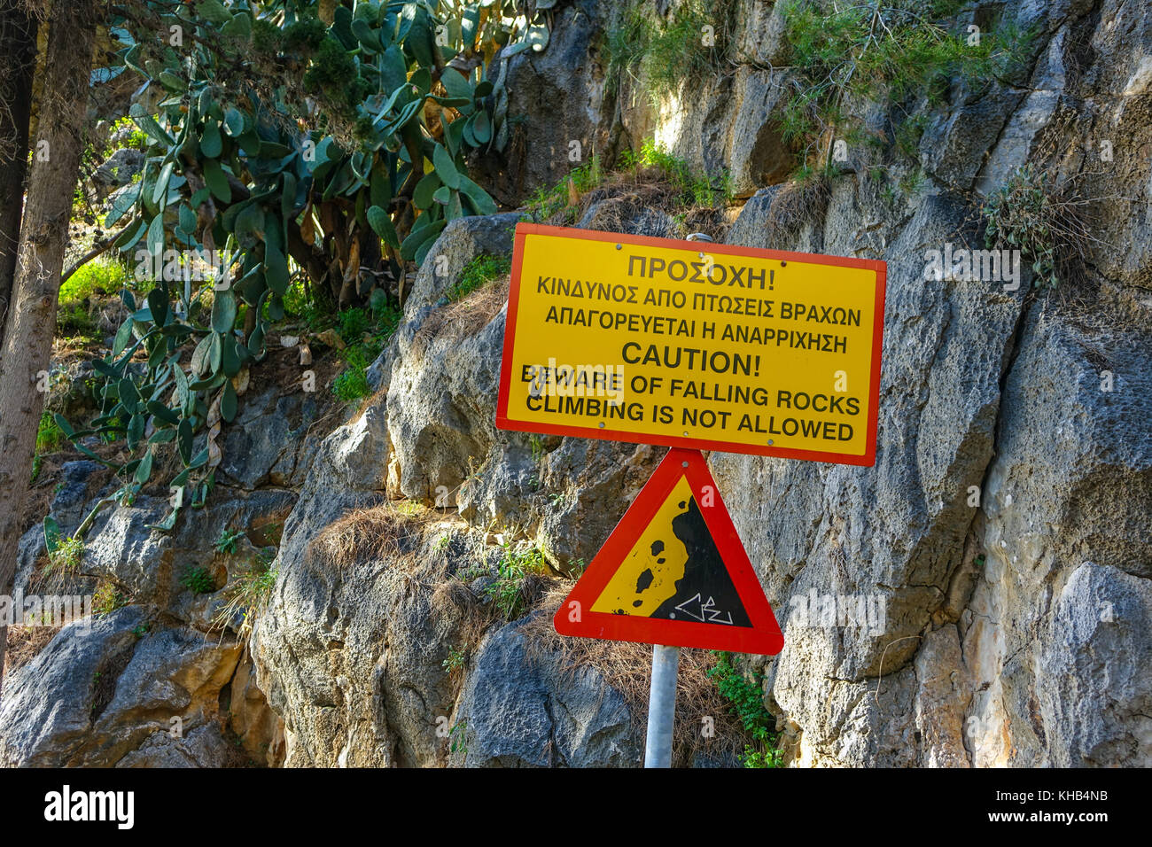 Warning sign in Greek and English, falling rocks, no climbing, Nafplio